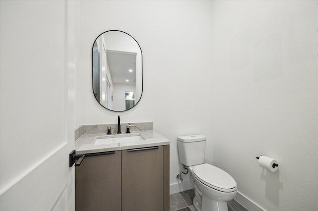 709 Moody St, Houston, TX 77009 - bathroom featuring toilet, vanity, and baseboards