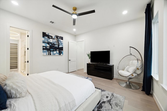 709 Moody St, Houston, TX 77009 - bedroom with wood finished floors, recessed lighting, baseboards, ceiling fan, and ensuite bath