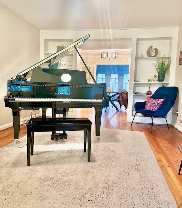 1062 Lamonte Ln, Houston, TX 77018 - living area featuring a chandelier, wood finished floors, and baseboards