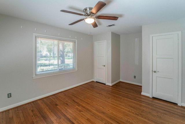 1062 Lamonte Ln, Houston, TX 77018 - unfurnished bedroom with wood finished floors, baseboards, and a ceiling fan