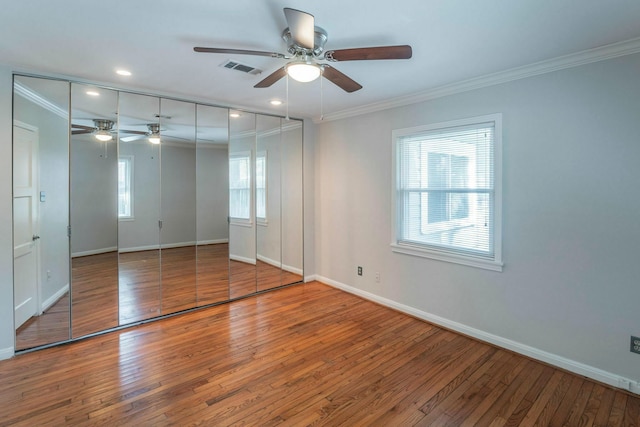 1062 Lamonte Ln, Houston, TX 77018 - unfurnished bedroom featuring ornamental molding, baseboards, wood-type flooring, and recessed lighting
