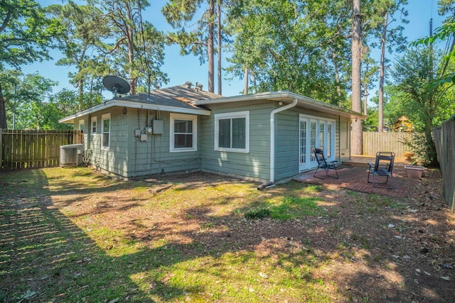 1062 Lamonte Ln, Houston, TX 77018 - back of property with french doors, a fenced backyard, and cooling unit