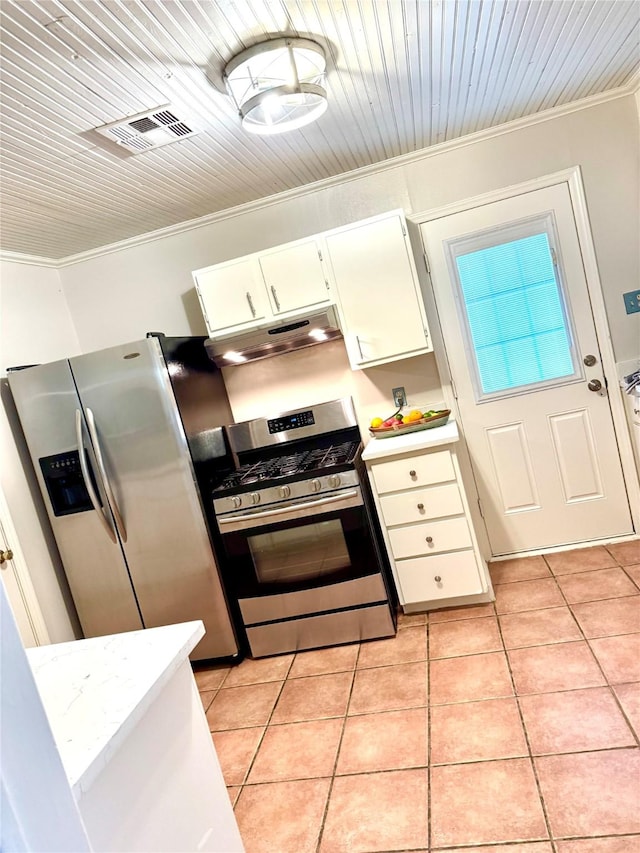 1062 Lamonte Ln, Houston, TX 77018 - kitchen featuring appliances with stainless steel finishes, ornamental molding, under cabinet range hood, light countertops, and light tile patterned floors
