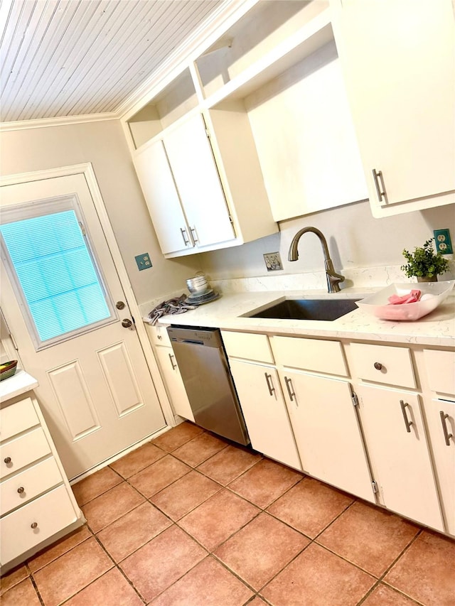 1062 Lamonte Ln, Houston, TX 77018 - kitchen featuring stainless steel dishwasher, light countertops, light tile patterned flooring, ornamental molding, and white cabinets
