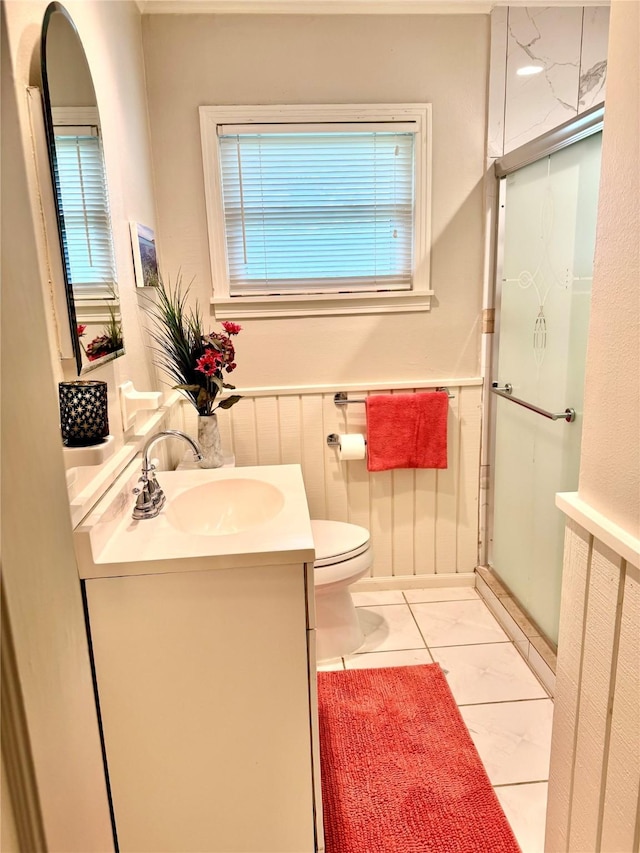 1062 Lamonte Ln, Houston, TX 77018 - full bathroom with vanity, a shower with door, and a wainscoted wall