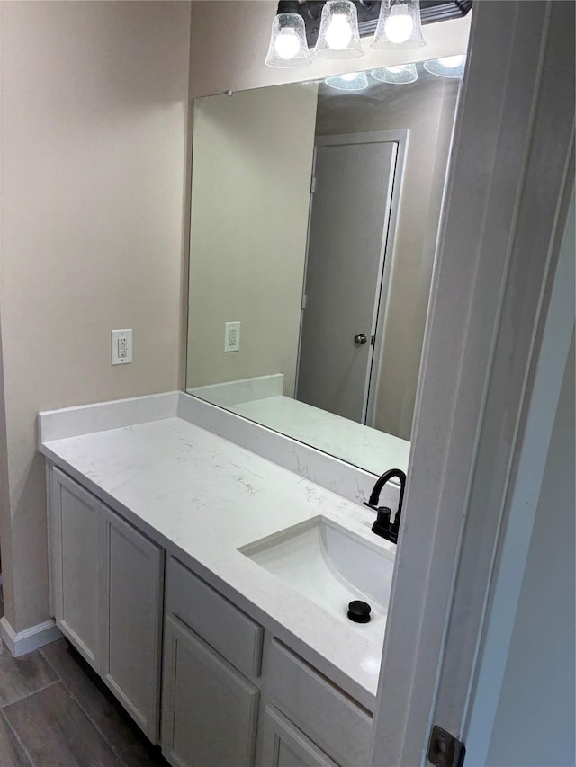 19638 Plantation Grove Trl, Katy, TX 77449 - bathroom with vanity, wood finished floors, and baseboards