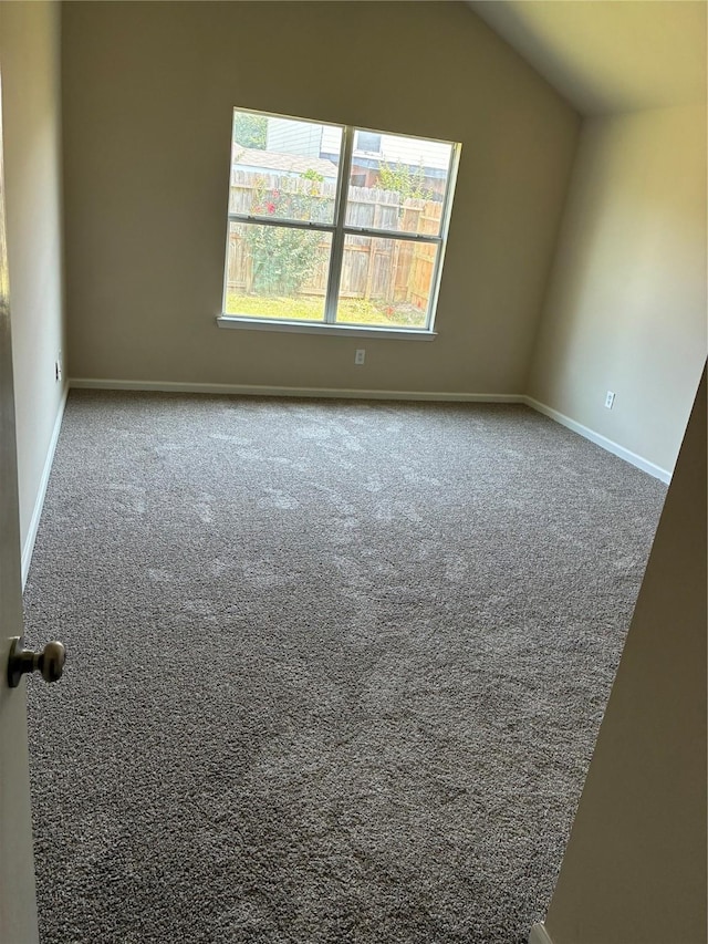 19638 Plantation Grove Trl, Katy, TX 77449 - carpeted spare room featuring vaulted ceiling and baseboards