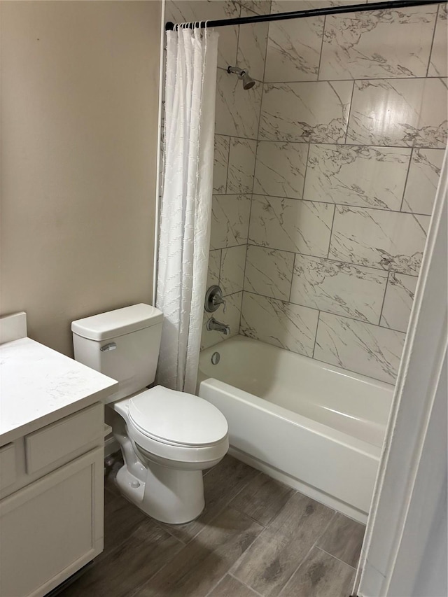 19638 Plantation Grove Trl, Katy, TX 77449 - bathroom featuring shower / bath combination with curtain, wood finished floors, toilet, and vanity