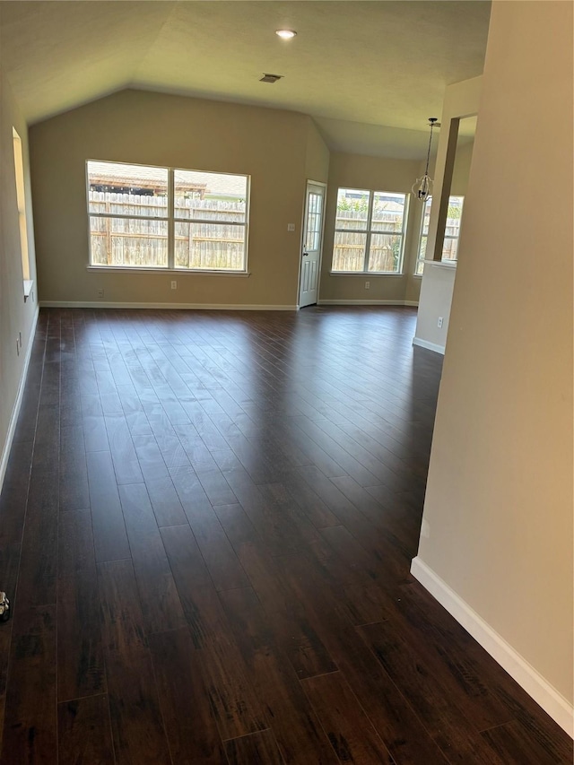 19638 Plantation Grove Trl, Katy, TX 77449 - unfurnished living room featuring dark wood finished floors, baseboards, and lofted ceiling