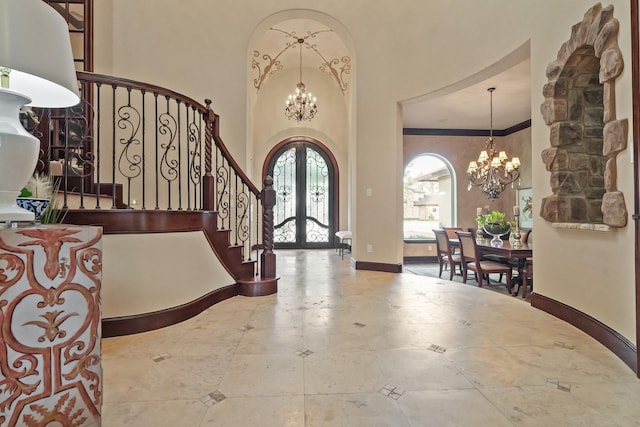 14 Royal King Rd, Tomball, TX 77377 - entrance foyer with a chandelier, french doors, stairs, a high ceiling, and ornamental molding