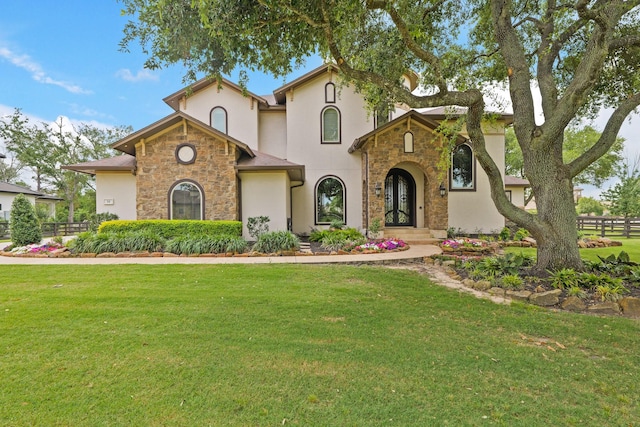 14 Royal King Rd, Tomball, TX 77377 - mediterranean / spanish house with stone siding, stucco siding, and french doors