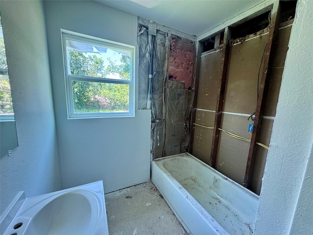 4526 Edfield St, Houston, TX 77051 - bathroom with a bathtub, unfinished concrete flooring, and a shower