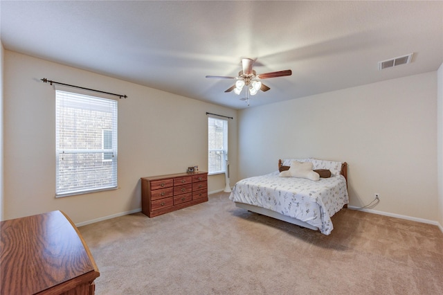 bedroom featuring carpet, baseboards, and ceiling fan