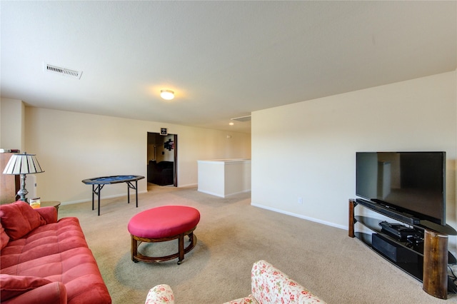 living room featuring carpet floors and baseboards