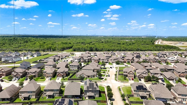 aerial view of residential area featuring a heavily wooded area