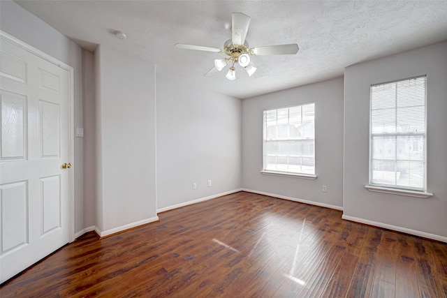 2710 Grants Lake Blvd Unit L8, Sugar Land, TX 77479 - empty room featuring wood finished floors, baseboards, ceiling fan, and a smoke detector