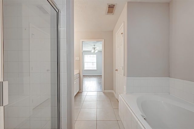 2710 Grants Lake Blvd Unit L8, Sugar Land, TX 77479 - full bath with a garden tub, a shower stall, tile patterned flooring, and vanity