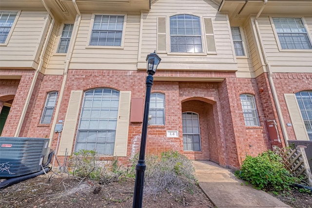 2710 Grants Lake Blvd Unit L8, Sugar Land, TX 77479 - property entrance with brick siding and cooling unit