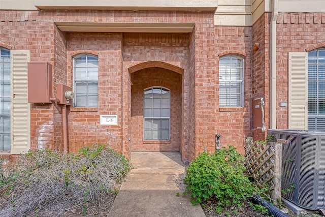 2710 Grants Lake Blvd Unit L8, Sugar Land, TX 77479 - entrance to property with central air condition unit and brick siding