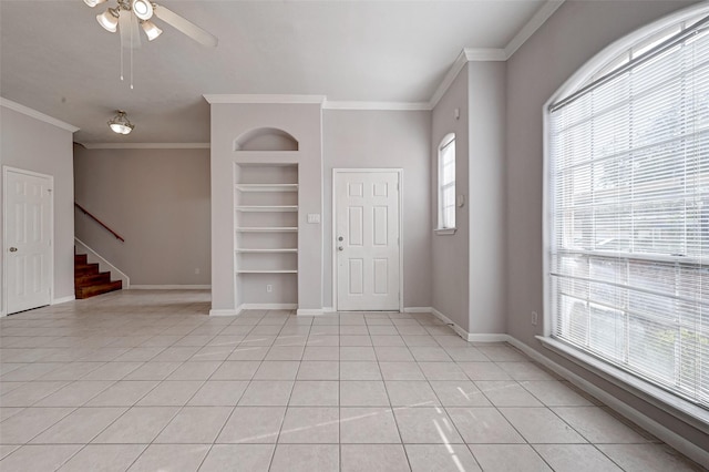2710 Grants Lake Blvd Unit L8, Sugar Land, TX 77479 - spare room with built in features, ornamental molding, stairs, light tile patterned floors, and baseboards