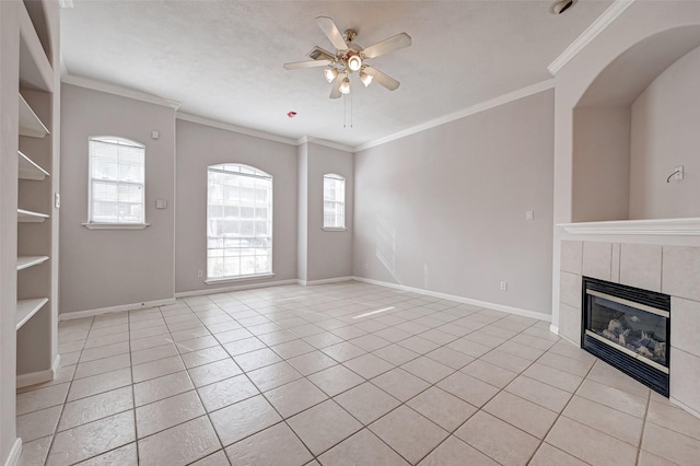 2710 Grants Lake Blvd Unit L8, Sugar Land, TX 77479 - unfurnished living room featuring ceiling fan, plenty of natural light, ornamental molding, a fireplace, and baseboards