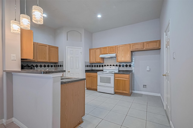 2710 Grants Lake Blvd Unit L8, Sugar Land, TX 77479 - kitchen with white range with electric stovetop, under cabinet range hood, dark countertops, decorative backsplash, and recessed lighting