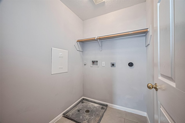 2710 Grants Lake Blvd Unit L8, Sugar Land, TX 77479 - laundry room featuring electric dryer hookup, baseboards, washer hookup, tile patterned floors, and gas dryer hookup