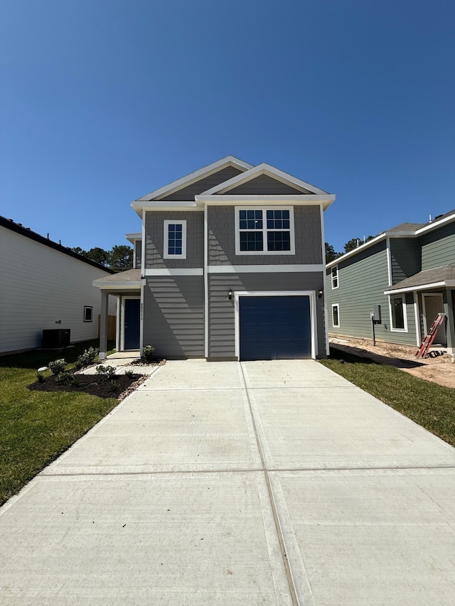 22711 American Kestrel Ct, Splendora, TX 77372 - view of front of property featuring a garage, driveway, and central air condition unit