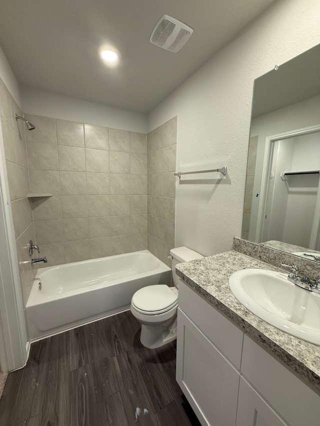 22711 American Kestrel Ct, Splendora, TX 77372 - full bathroom featuring wood finished floors, toilet, shower / bathtub combination, and vanity