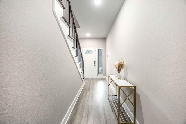 5023 Mallow St A/B, Unit A/B Houston, TX 77033 - entryway featuring baseboards, wood finished floors, a textured wall, stairway, and recessed lighting