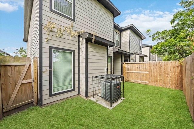 5023 Mallow St A/B, Unit A/B Houston, TX 77033 - view of side of property with central AC and a gate