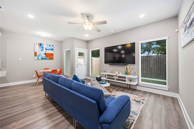 5023 Mallow St A/B, Unit A/B Houston, TX 77033 - living room with healthy amount of natural light, ceiling fan, baseboards, wood finished floors, and recessed lighting