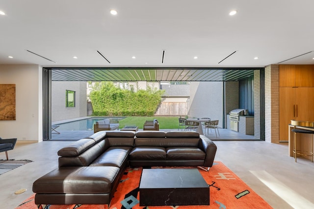 2021 Albans Rd, Houston, TX 77005 - living room featuring concrete flooring and recessed lighting