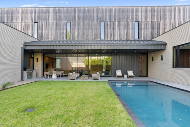 2021 Albans Rd, Houston, TX 77005 - rear view of house featuring a standing seam roof, an outdoor living space, a patio area, a yard, and metal roof