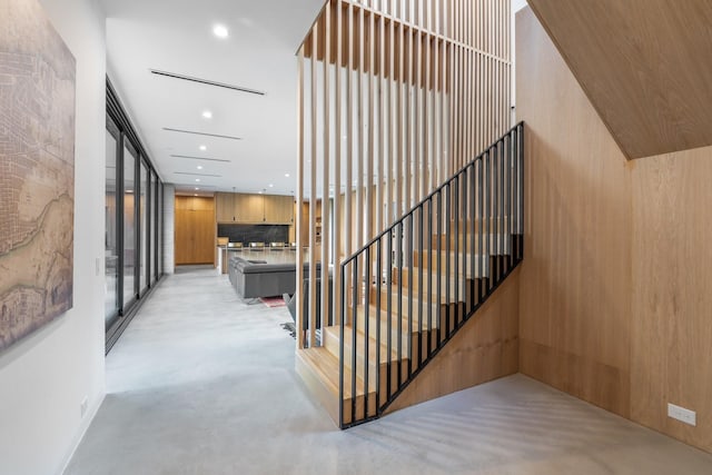 2021 Albans Rd, Houston, TX 77005 - staircase with concrete flooring and recessed lighting