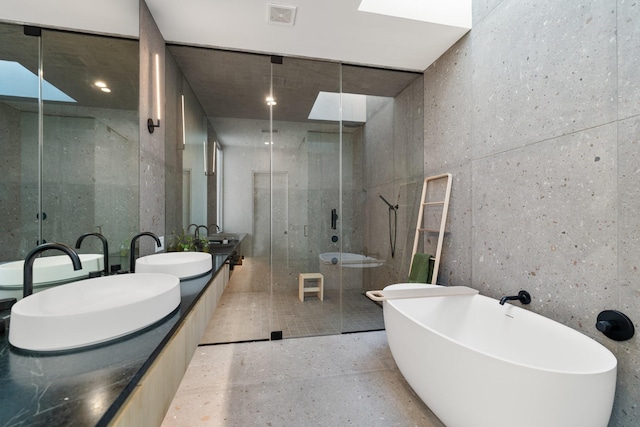 2021 Albans Rd, Houston, TX 77005 - full bath featuring a shower stall, double vanity, and a freestanding tub