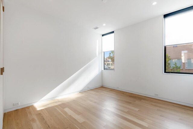 2021 Albans Rd, Houston, TX 77005 - unfurnished room with light wood-style flooring, recessed lighting, and baseboards