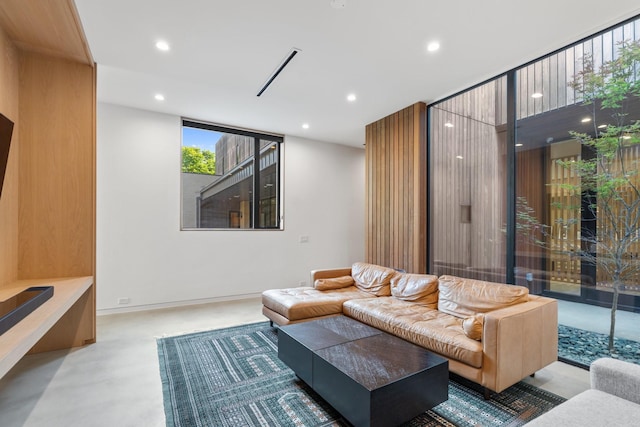 2021 Albans Rd, Houston, TX 77005 - living room featuring recessed lighting, finished concrete floors, and baseboards