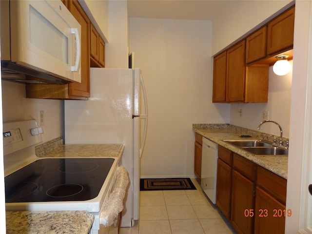 434 Wilcrest Dr Unit 434, Houston, TX 77042 - kitchen featuring white appliances, a sink, brown cabinets, and light countertops