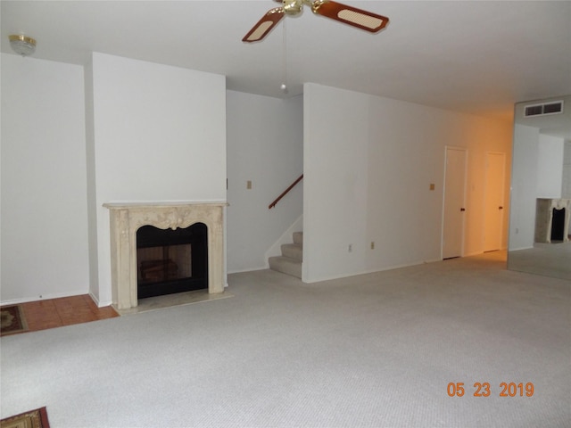 434 Wilcrest Dr Unit 434, Houston, TX 77042 - unfurnished living room with a premium fireplace, ceiling fan, stairway, and carpet
