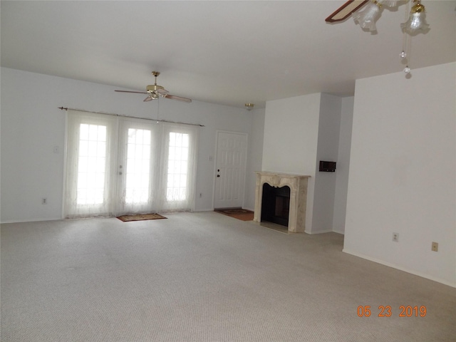 434 Wilcrest Dr Unit 434, Houston, TX 77042 - unfurnished living room with a ceiling fan, carpet, a high end fireplace, and baseboards