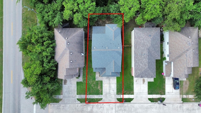aerial view of property and surrounding area featuring property parcel outlined