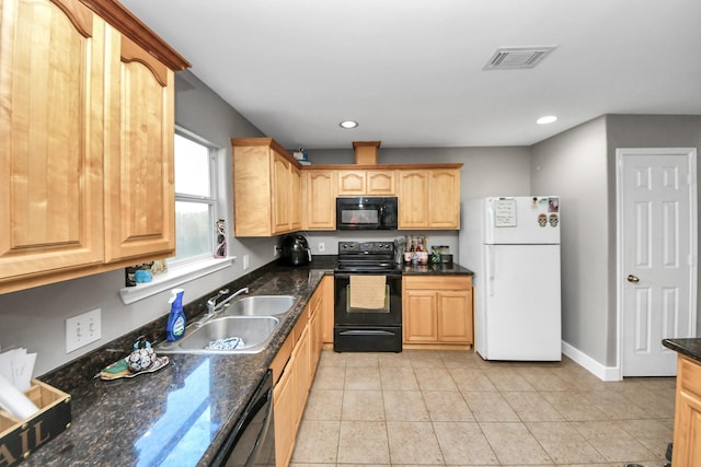 kitchen featuring black appliances, a sink, recessed lighting, light tile patterned flooring, and light brown cabinetry