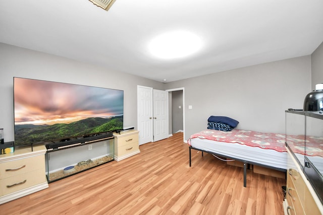 bedroom with light wood-style floors