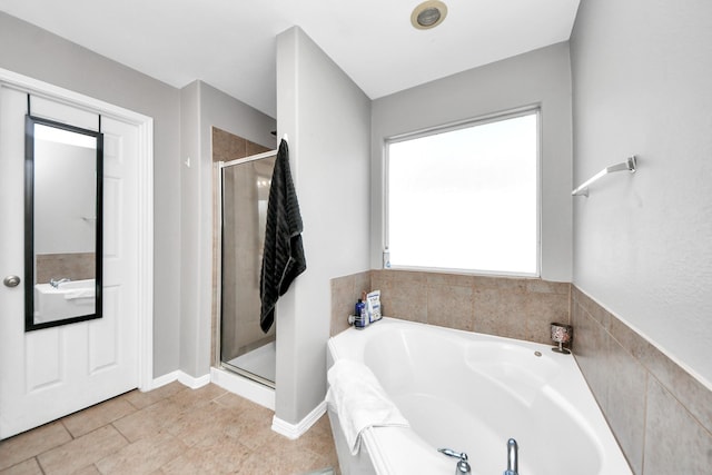 full bath featuring a stall shower and a bath