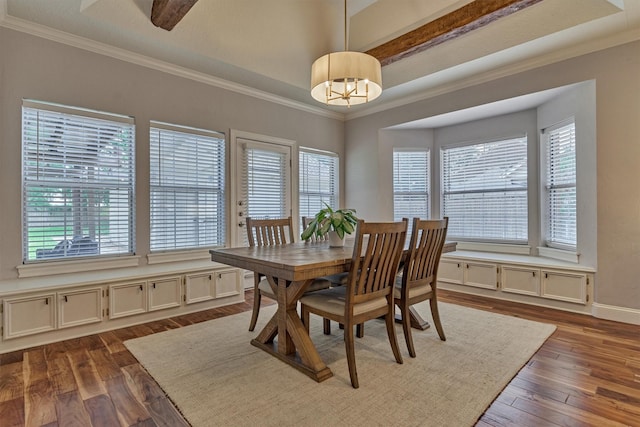 dining space with dark wood finished floors, ornamental molding, baseboards, and a chandelier