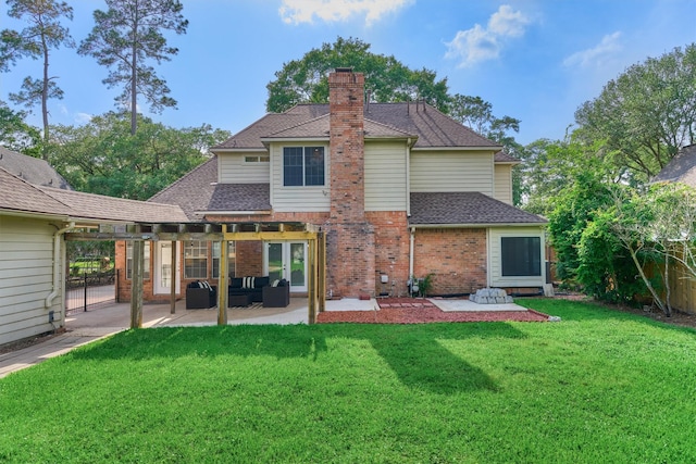 rear view of house with a patio area, a chimney, an outdoor living space, and a lawn