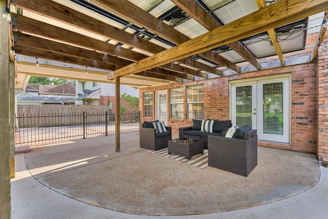 view of patio / terrace featuring french doors, fence, an outdoor hangout area, and a pergola