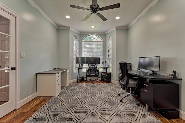 office featuring wood finished floors, ceiling fan, baseboards, crown molding, and recessed lighting