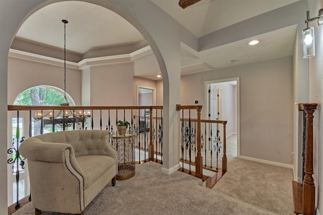 sitting room featuring attic access, carpet floors, baseboards, an upstairs landing, and recessed lighting